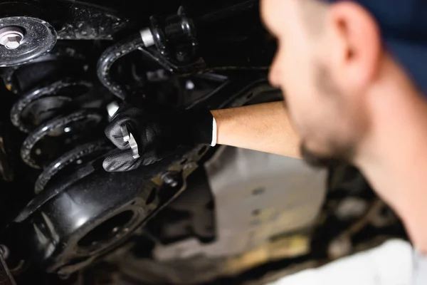Selective Focus Mechanic Holding Wrench While Fixing Vehicle — Stock Photo, Image