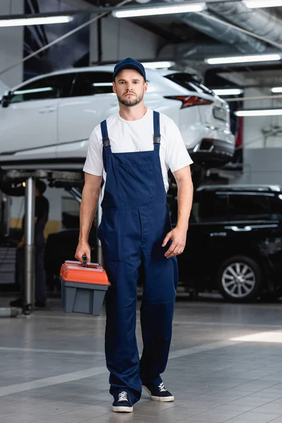 Handsome Mechanic Overalls Cap Holding Toolbox Service Station — Stock Photo, Image