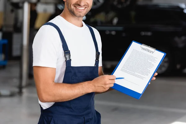 Cropped View Happy Mechanic Overalls Cap Holding Clipboard Contract Lettering — Stock Photo, Image