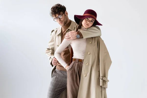 Stylish Man Hugging Trendy Woman While Posing Autumn Outfit Isolated — Stock Photo, Image