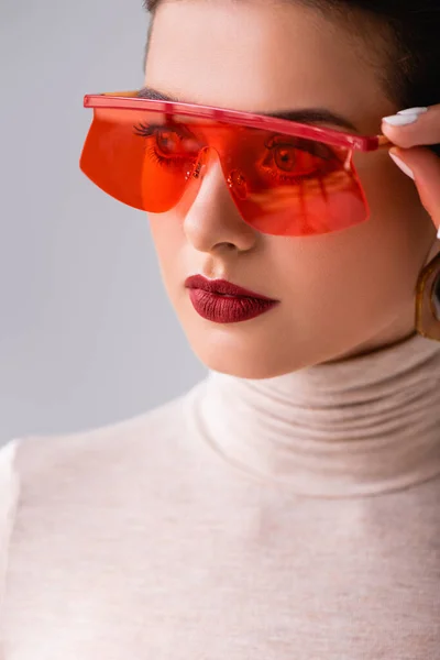 Portrait Attractive Girl Red Sunglasses Looking Away Touching Frames Isolated — Stock Photo, Image