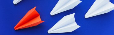 top view of white and red paper planes on blue background, leadership concept, panoramic shot clipart