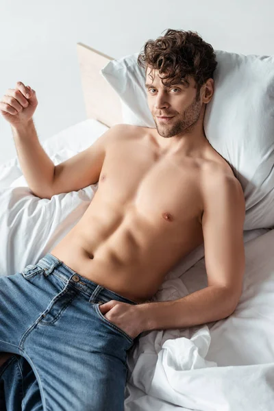 Shirtless Man Hand Pocket Jeans Looking Camera Bed Isolated White — Stock Photo, Image