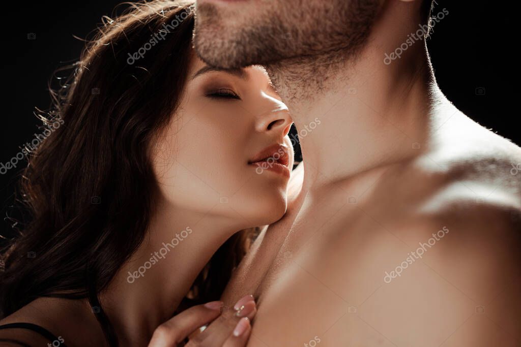 Woman touching mans chest