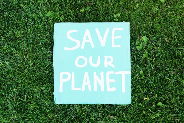 Top View Our Planet Lettering Poster Green Grass Ecology Concept — Foto de Stock