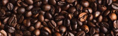 top view of fresh roasted coffee beans background, panoramic shot clipart
