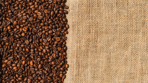 top view of roasted coffee beans on sackcloth