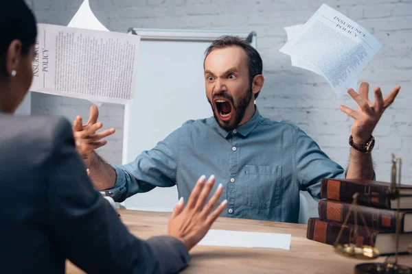 Selective Focus Angry Bearded Man Screaming While Throwing Air Documents — Stock Photo, Image