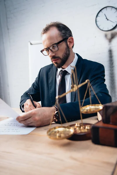 Selective Focus Bearded Lawyer Signing Insurance Documents Golden Scales Books — Stock Photo, Image