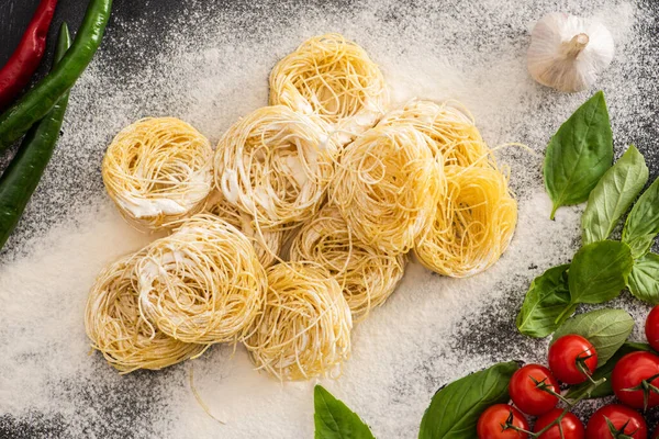 Top View Raw Capellini Pasta Vegetables Flour — Stock Photo, Image