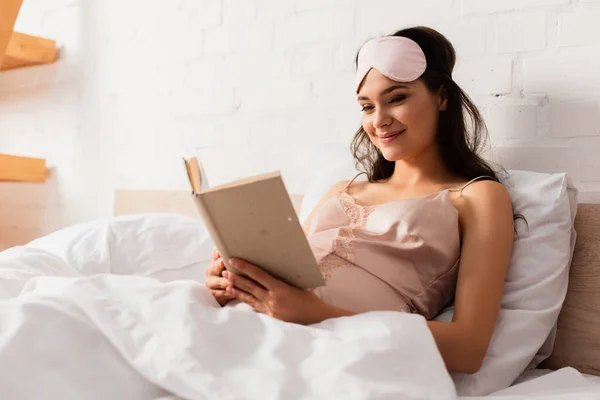 Pregnant Young Woman Silk Nightie Eye Mask Reading Book Bedroom — Stock Photo, Image