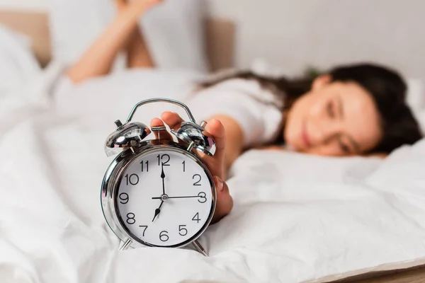 Selective Focus Woman Lying Bed Reaching Retro Alarm Clock — Stock Photo, Image