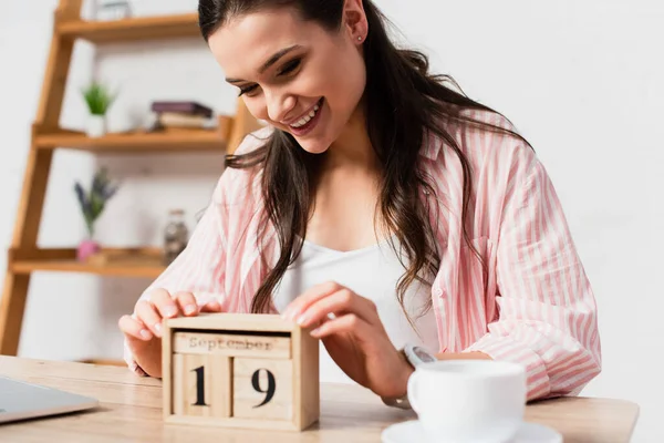 Selective Focus Brunette Woman Touching Wooden Cubes Date Cup — Stock Photo, Image
