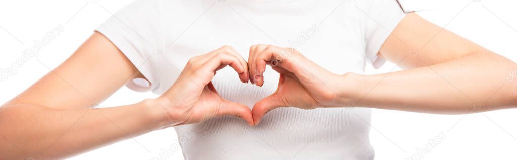 panoramic crop of woman showing heart sign with hands isolated on white