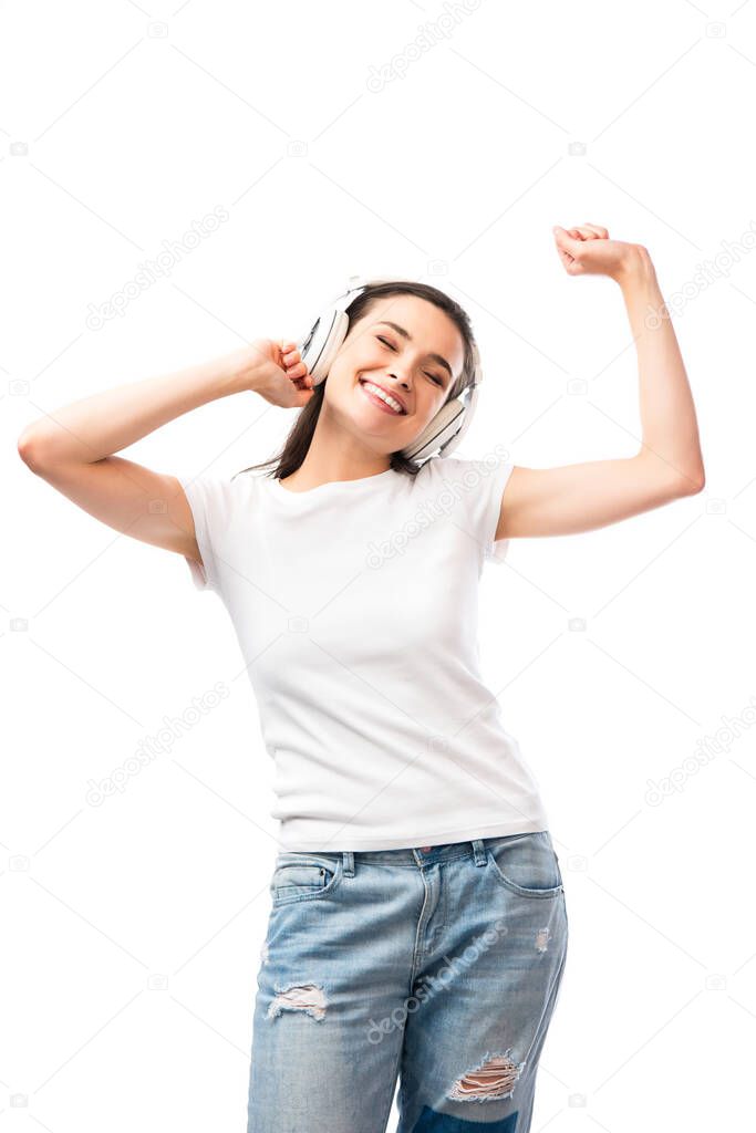 young woman with closed eyes in white t-shirt and wireless headphones isolated on white 