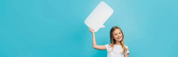 Horizontal Concept Child Holding Speech Bubble Looking Camera Isolated Blue — Stock Photo, Image