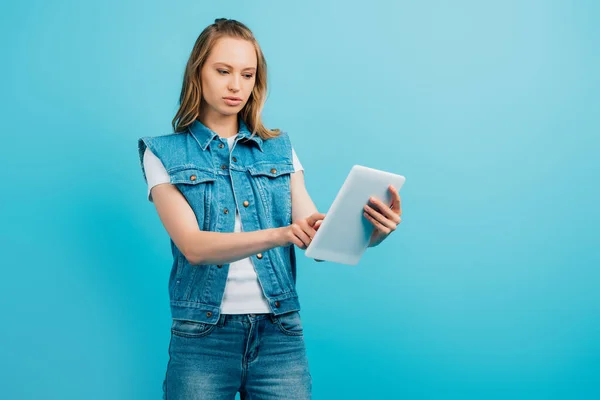 Concentrated Woman Denim Vest Using Digital Tablet Isolated Blue — Stock Photo, Image