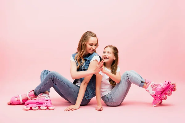 Mother Daughter Denim Clothes Sitting Floor Roller Skates Giving High — Stock Photo, Image