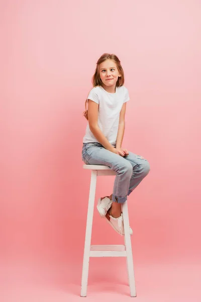 Kid White Shirt Jeans Grimacing Squinting While Sitting High Stool — Stock Photo, Image