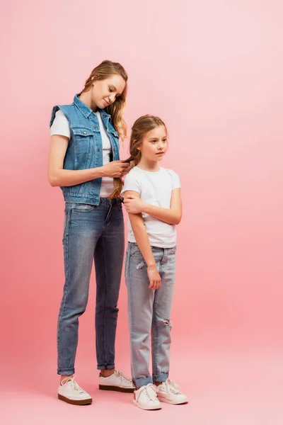 Full Length View Woman Denim Clothes Braiding Hair Daughter While — Stock Photo, Image