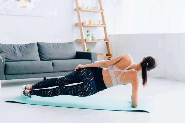 Back View Sportswoman Doing Side Plank Living Room — Stock Photo, Image