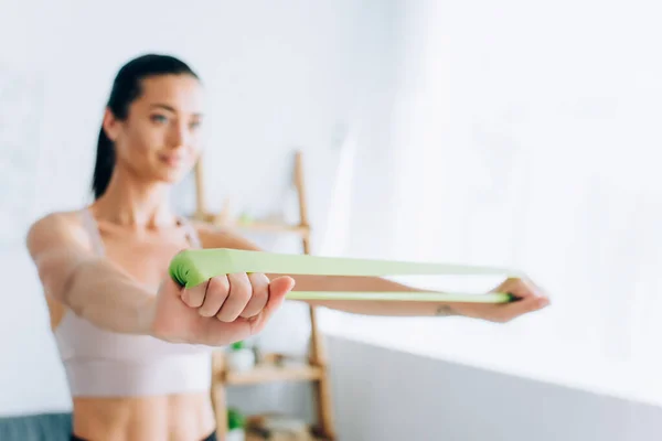 Selective Focus Young Sportswoman Using Resistance Band While Exercising Home — Stock Photo, Image