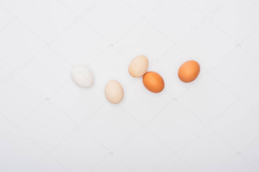 top view of fresh chicken eggs isolated on white