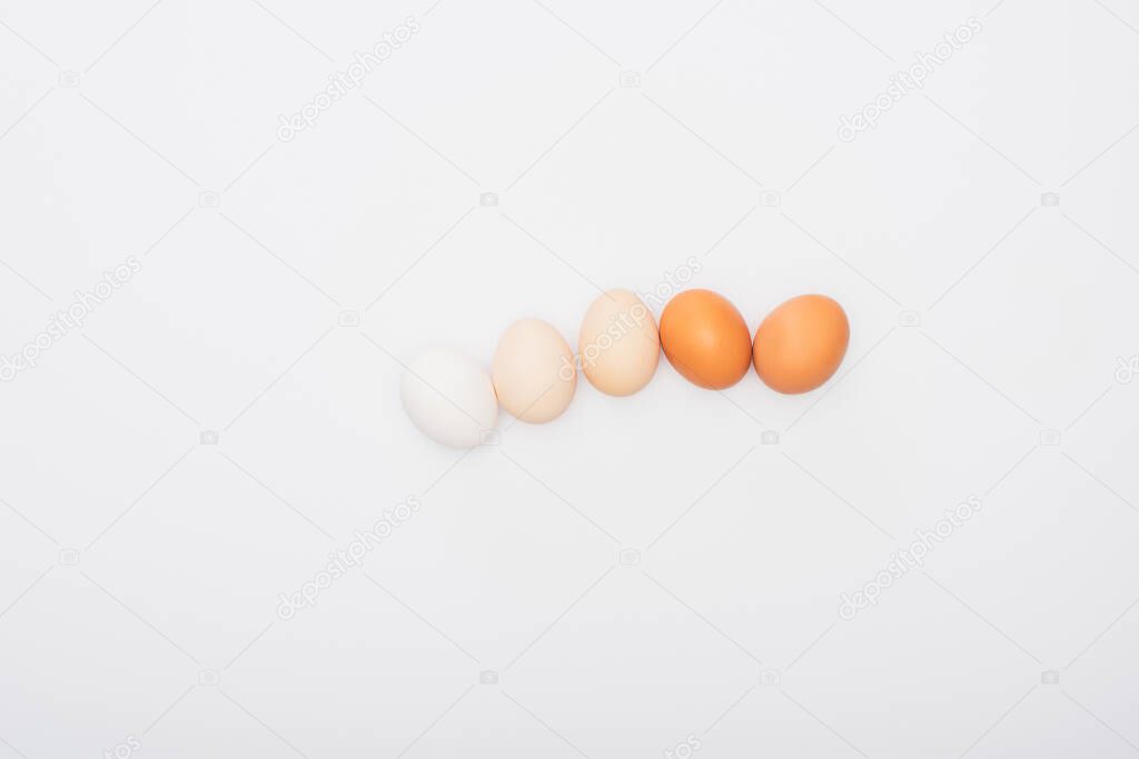 top view of fresh chicken eggs isolated on white