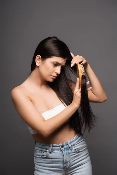 Sad Brunette Woman Brushing Hair Isolated Black — Stock Photo, Image