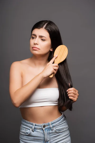 Sad Brunette Woman Brushing Hair Isolated Black — Stock Photo, Image