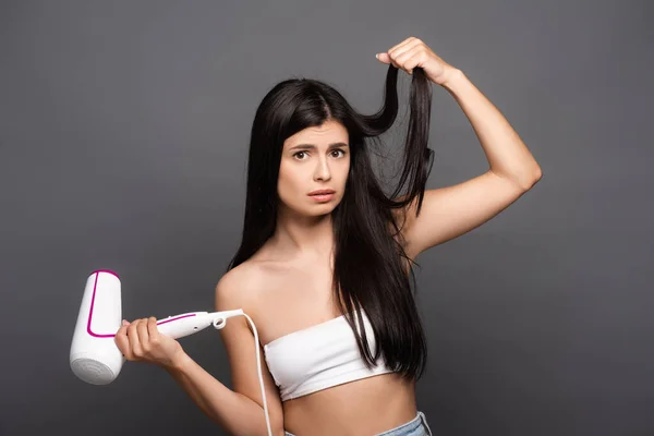 Upset Brunette Woman Holding Hair Dryer Isolated Black — Stock Photo, Image