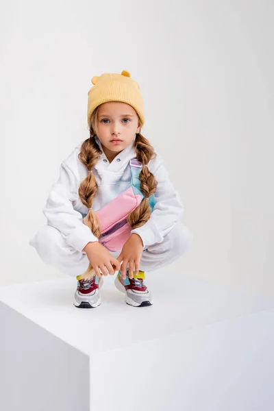 Blonde Girl Sportswear Sitting Cube Isolated White — Stock Photo, Image