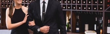 Website header of elegant woman touching hand of boyfriend in suit in restaurant  clipart