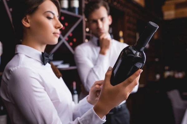 Selective Focus Sommelier Holding Bottle Wine Colleague Restaurant — Stock Photo, Image