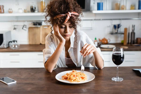 Sad Curly Woman Holding Fork Plate Prepared Spaghetti Glass Wine — Stock Photo, Image