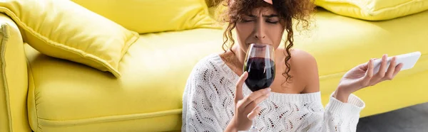 Panoramic Crop Curly Woman Holding Glass Wine Smartphone While Crying — Stock Photo, Image