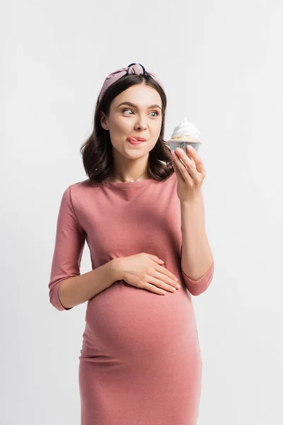 Joyful Woman Sticking Out Tongue Looking Cupcake Isolated White — Stock Photo, Image