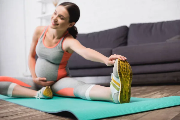 Selective Focus Pleased Pregnant Woman Sportswear Stretching Fitness Mat — Stock Photo, Image