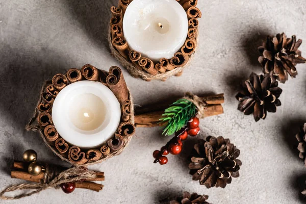 Top View Decorated Candles Cinnamon Sticks Pine Cones Rowan — Stock Photo, Image