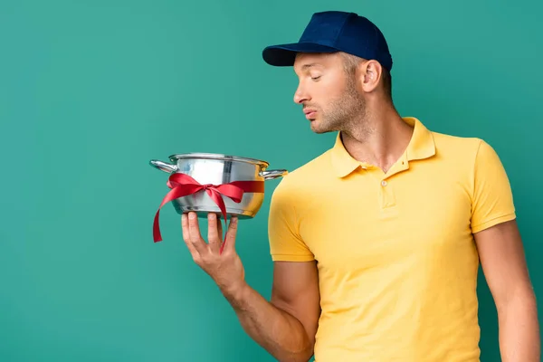 Delivery Man Cap Looking Saucepan Ribbon Blue — Stock Photo, Image