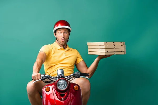 Surprised Delivery Man Helmet Riding Scooter While Holding Pizza Boxes — Stock Photo, Image