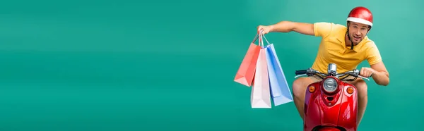 Delivery Man Helmet Riding Scooter While Holding Shopping Bags Blue — Stock Photo, Image