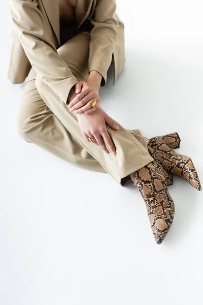 Cropped View Stylish Model Beige Suit Boots Animal Print Sitting — Stock Photo, Image