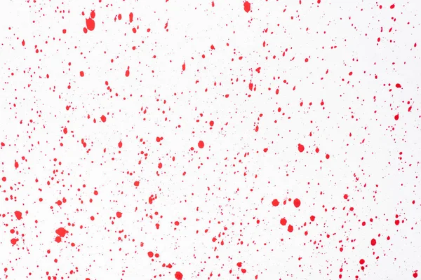 top view of abstract red paint stains on white background