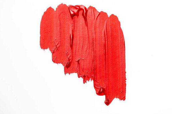 top view of abstract colorful red paint brushstrokes on white background