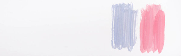 top view of abstract pink and blue paint brushstrokes on white background, panoramic shot