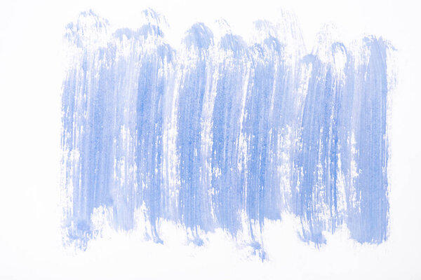 top view of abstract blue paint brushstrokes on white background