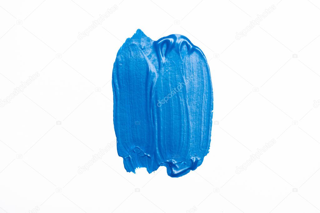 top view of abstract colorful blue paint brushstrokes on white background