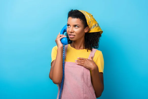 Curly African American Woman Talking Retro Telephone Blue — Stock Photo, Image