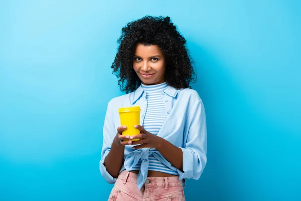 Pleased African American Woman Holding Empty Reusable Mug Blue — Stock Photo, Image